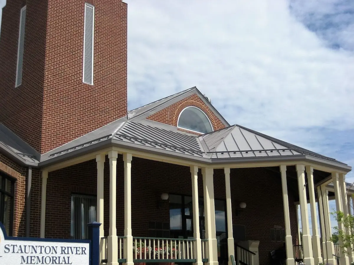 Skilled roofing craftsmen working on a residential roof in Richville